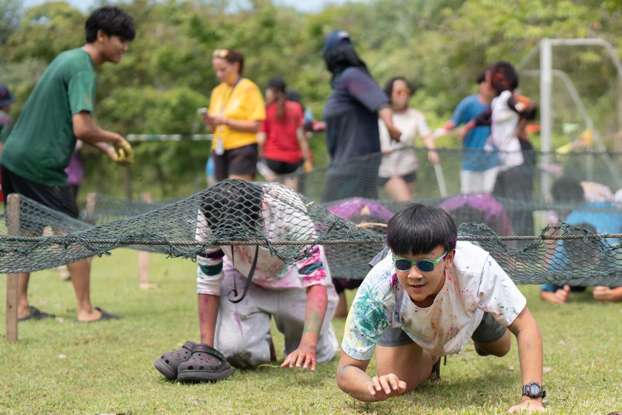 Campers playing a team game on the field