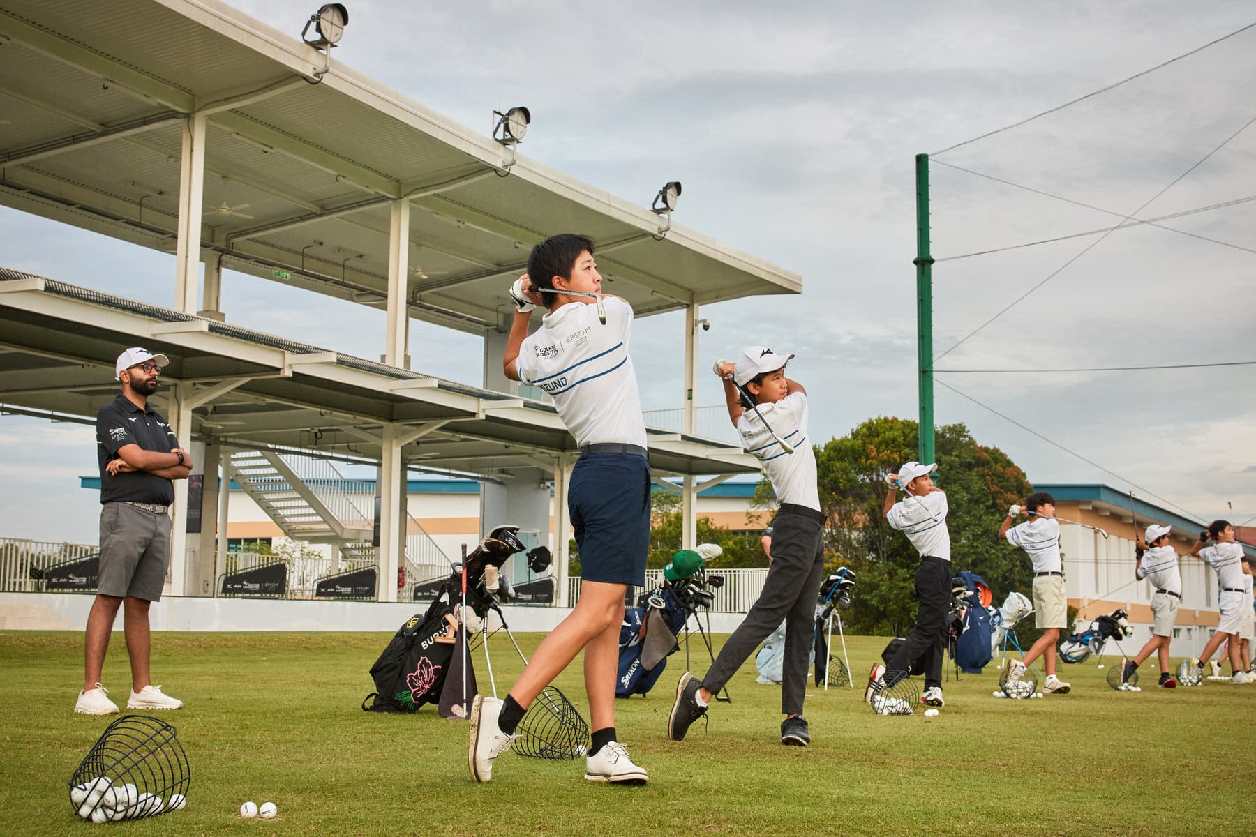 A camper practising at the on-campus driving range