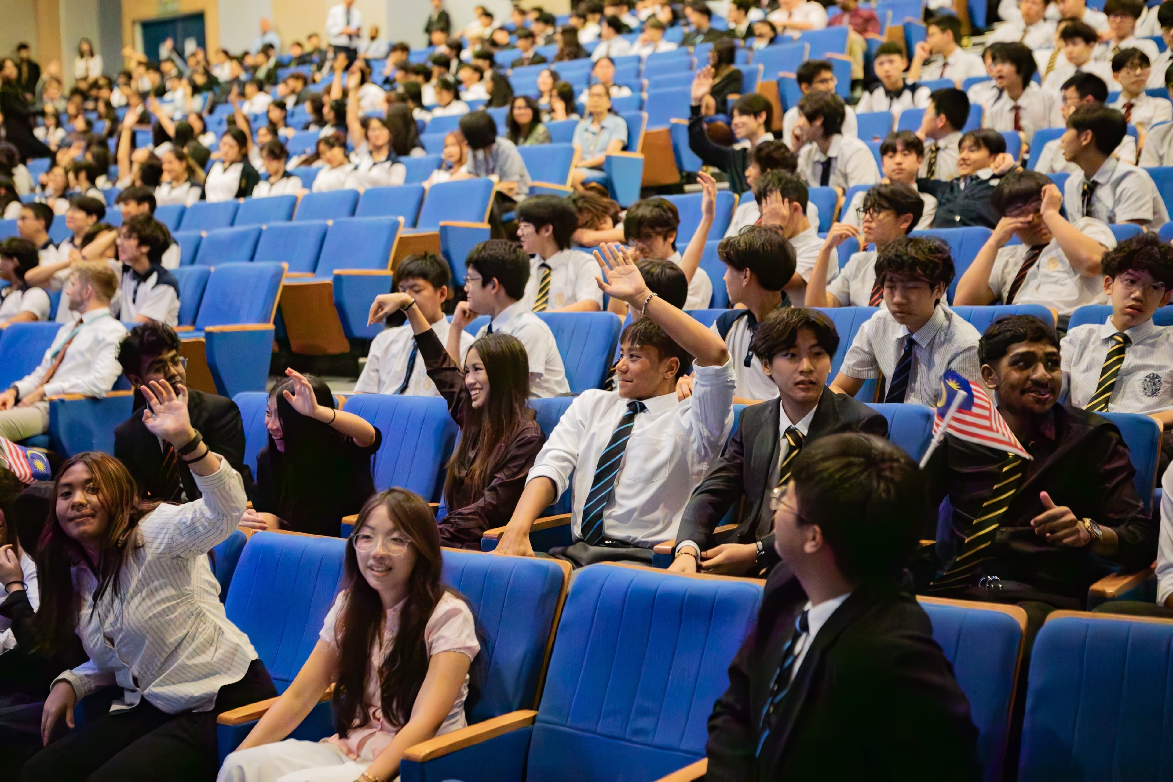 Students of diverse nationalities in Epsom's theater hall